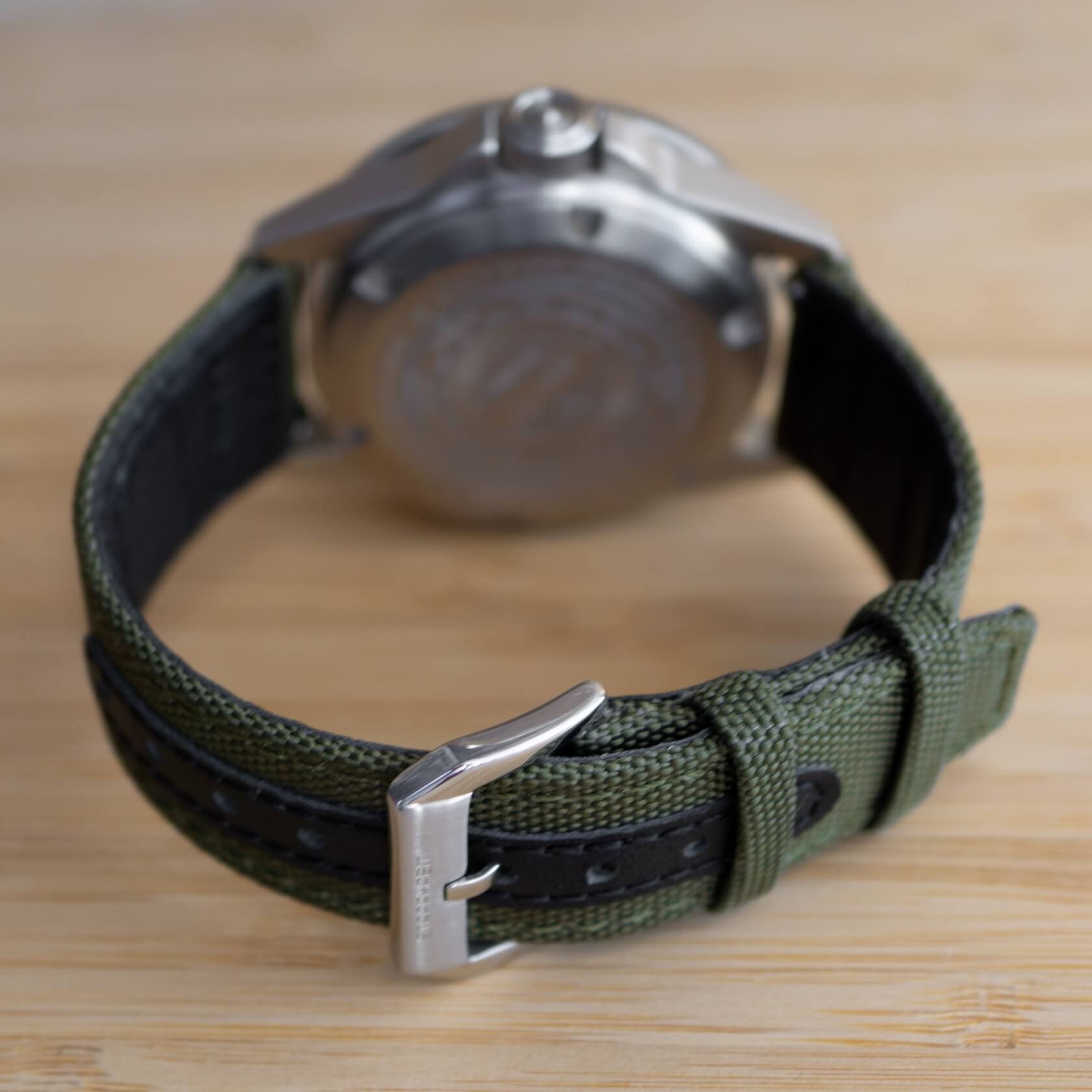 green sailcloth strap fitted on a watch